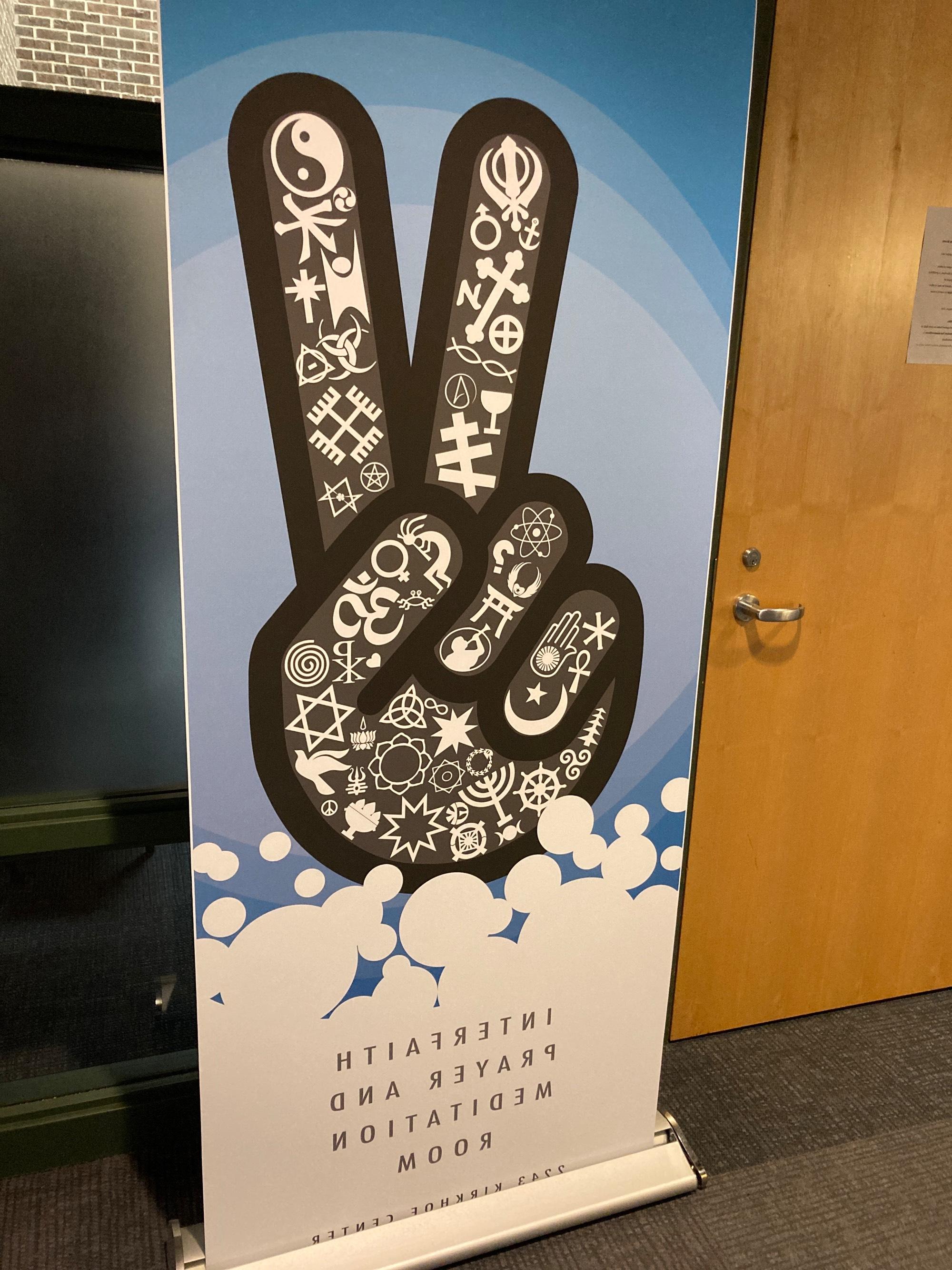 Peace sign banner with various religious symbols